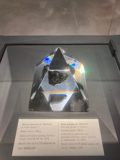Black stone in a transparent pyramid.