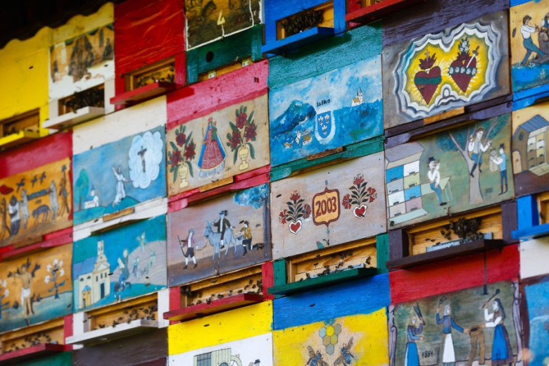 Painted beehive panels in traditional motifs from the Bible or Folk tales.