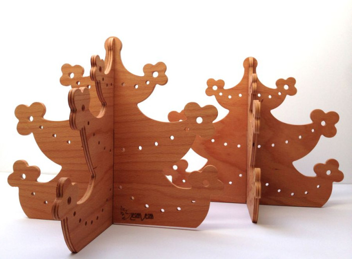 A two Christmas tree carved from wooden panels, with branches in the shape of flowers.
