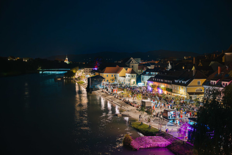 River and the city with lights at night.