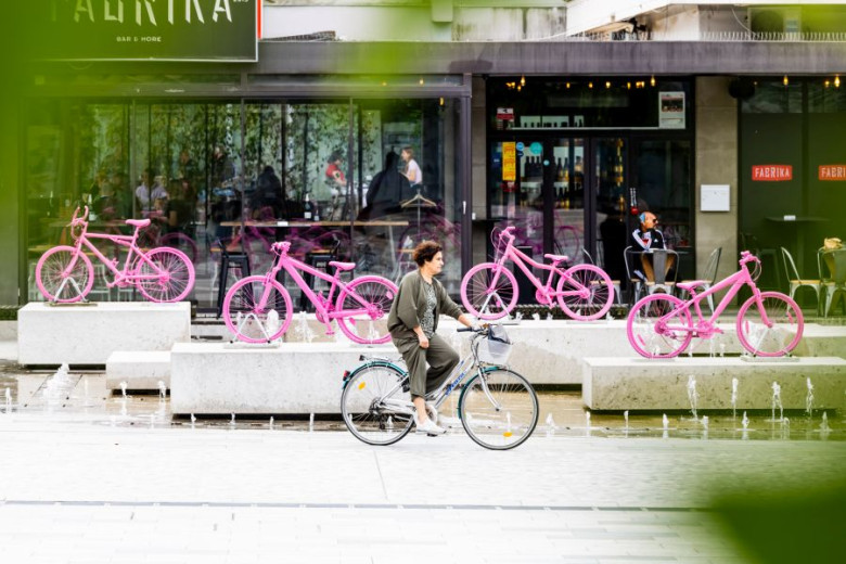 Woman on bicycle in Nova Gorica. 