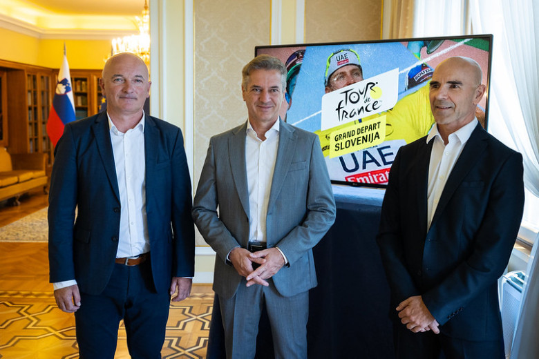 The speakers standing at the event. 