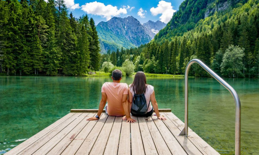 Couple sitting by the lake.