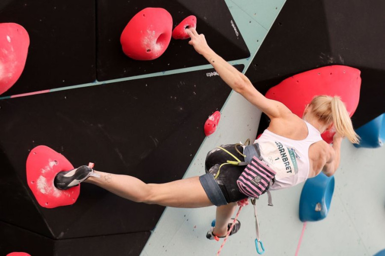 Woman is climbing in the wall