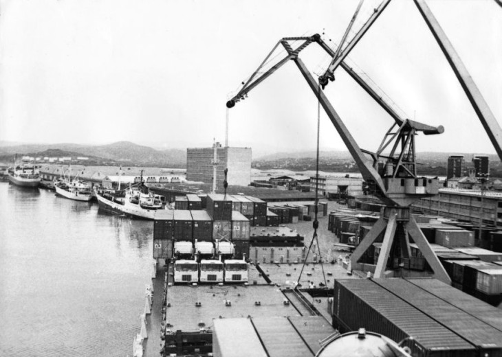 An old photo with the ships and big metal boxes
