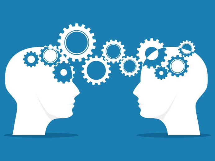 The image shows two white human head silhouettes facing each other on a blue background. Inside and between the heads are multiple interlocking gears of different sizes, connecting the two minds. The gears symbolize communication, exchange of ideas, and c