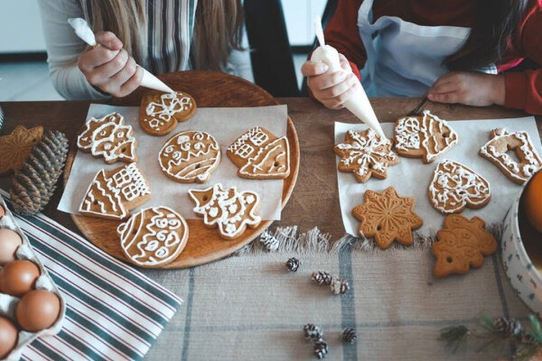 Two kids are doing ginger cookies