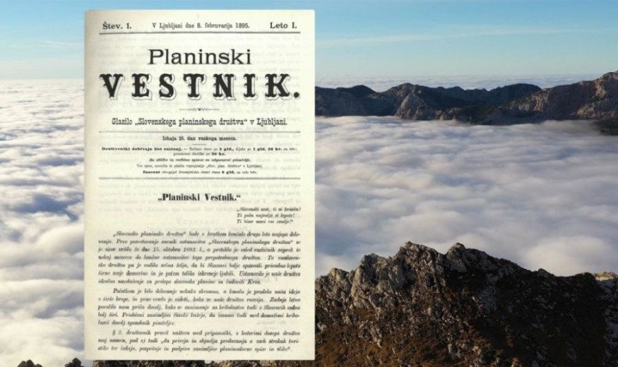 A first page of the old newspaper Planinski vestnik about mountains with mountains behind the page of the magazine.