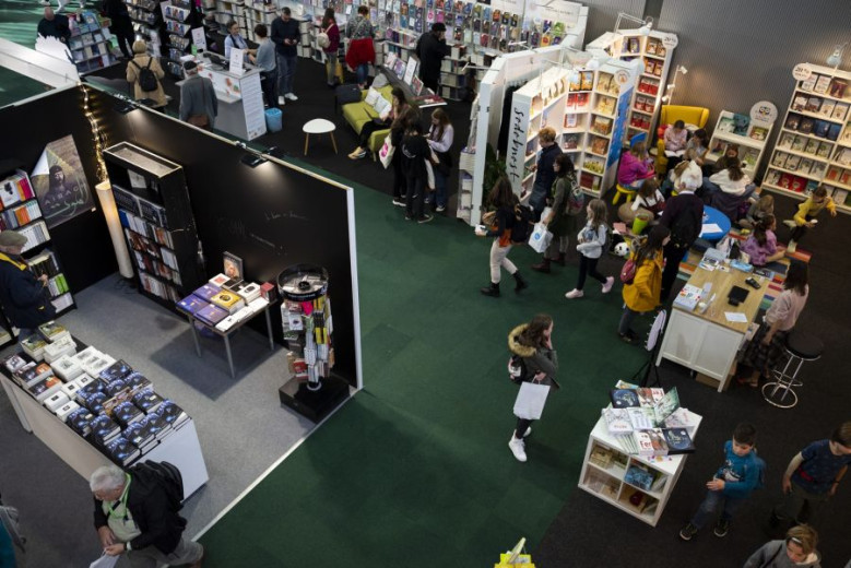 People are looking at the books in the large room