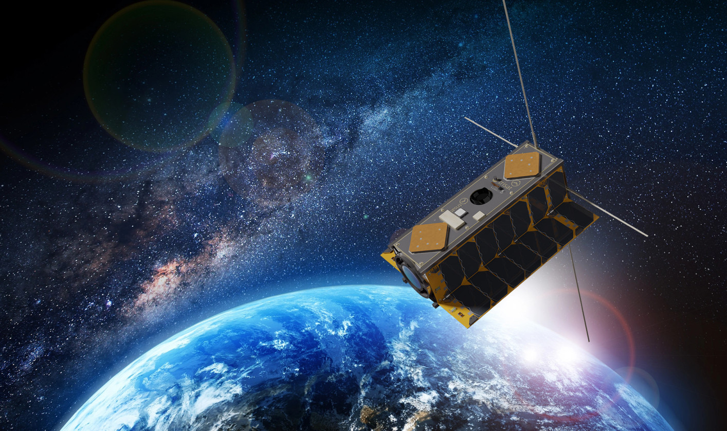 The satellite orbits above the Earth in space.