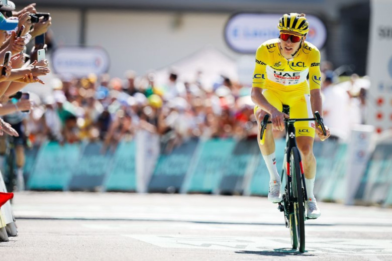 A man in yellow on the bicycle