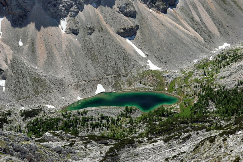 Green lake between mountains.