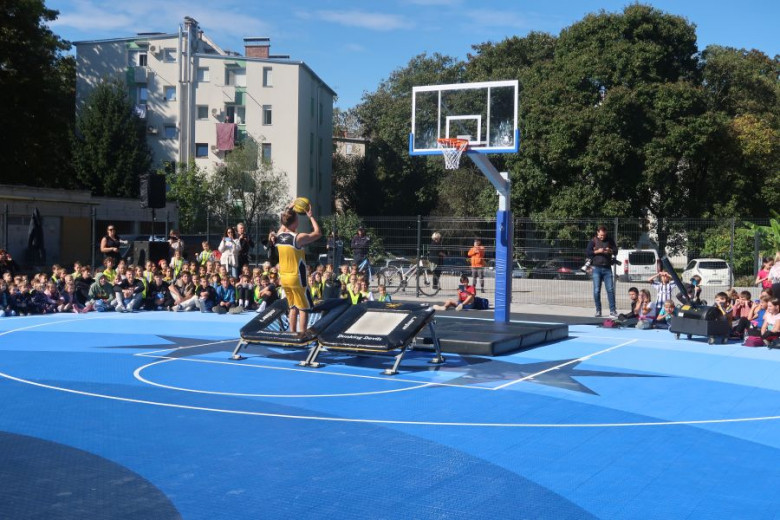 A basketball player on a court.