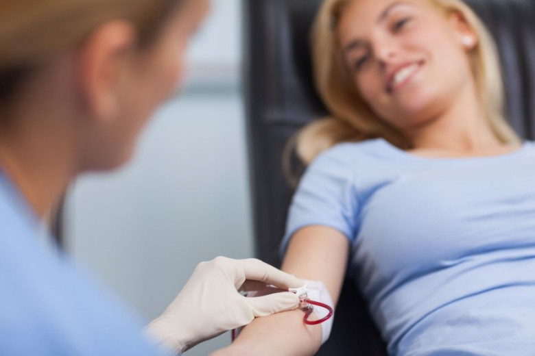 Nurse getting blood from on a female donor