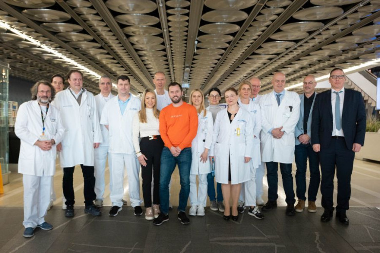 People in white coats and a married couple in the hospital