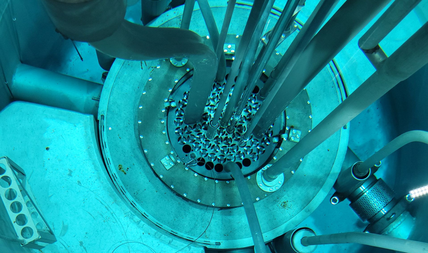 Inside Slovenia's TRIGA research reactor at the Jožef Stefan Institute, showing the reactor core and fuel elements beneath the water.
