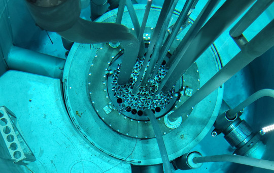 Inside Slovenia's TRIGA research reactor at the Jožef Stefan Institute, showing the reactor core and fuel elements beneath the water.