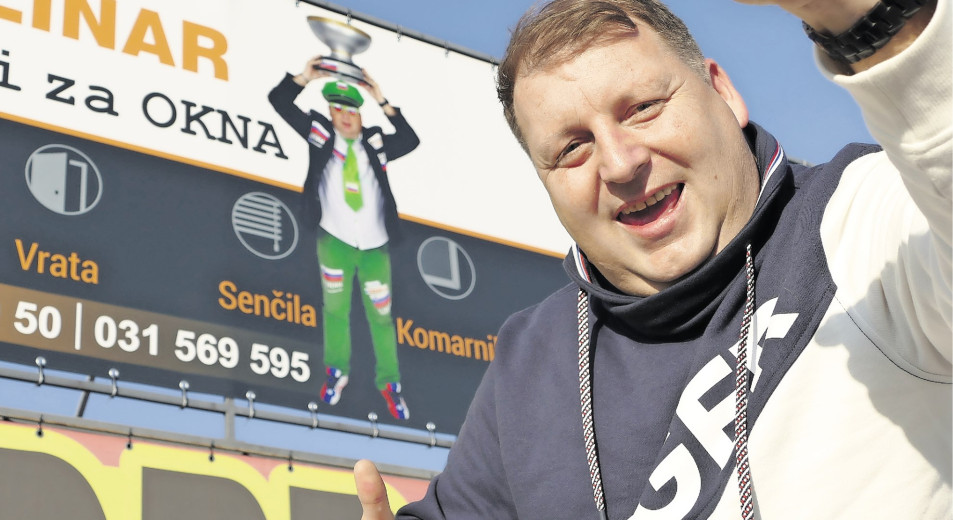 Javornik in front of the billboard where he is pictured.