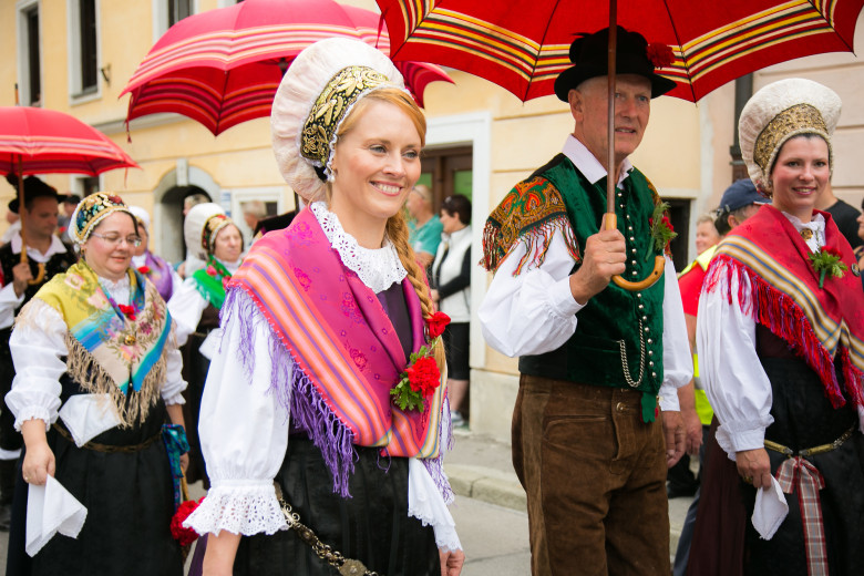 A couple in Gorenjska national costume in a procession. 