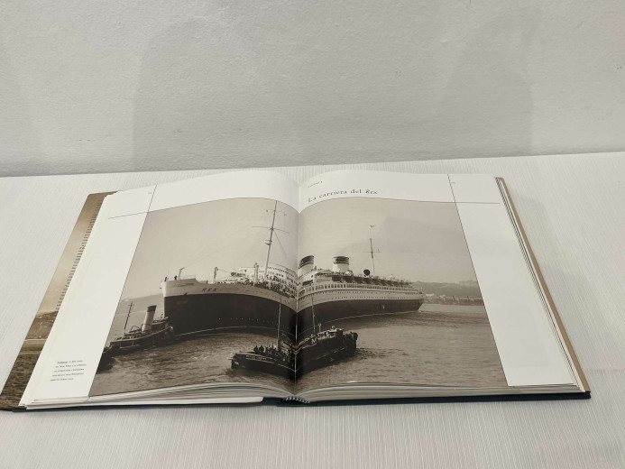 Black and white photograph of a ship, printed in a book.