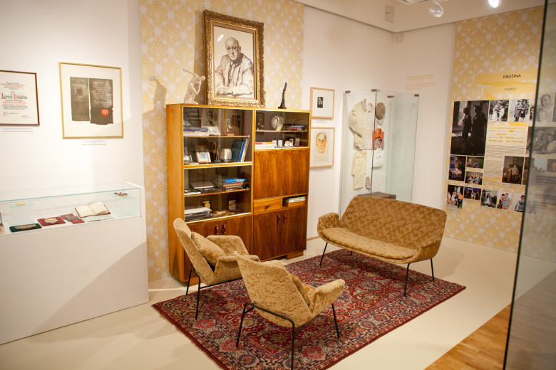 Exhibition space in the living room with photographs by Leon Štukelj.