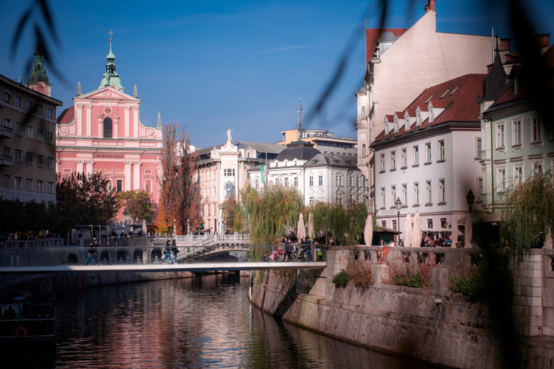 The Ljubljanica riverbank with the Franciscan Church in the background.