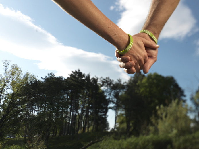 Two people holding hands.