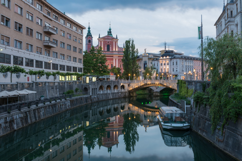 The Tromostovje bridge, with the Ljubljanica river in the foreground.