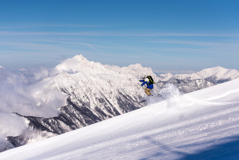 A skier descends a slope on Krvavec.