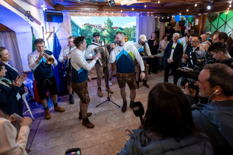 A lively gathering with musicians in lederhosen performing with brass and accordion